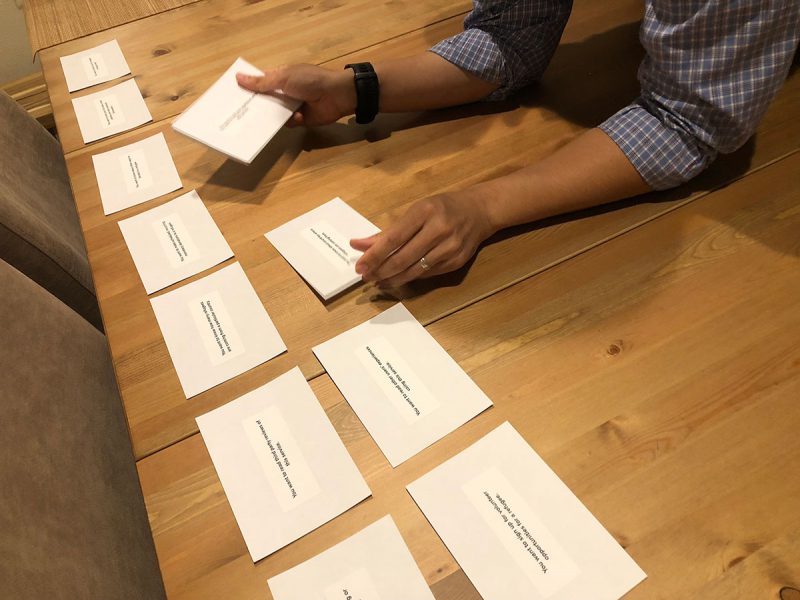 User Sorting Task Cards on Table